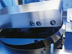 Quality-01 A close up of the front part of an industrial machine.